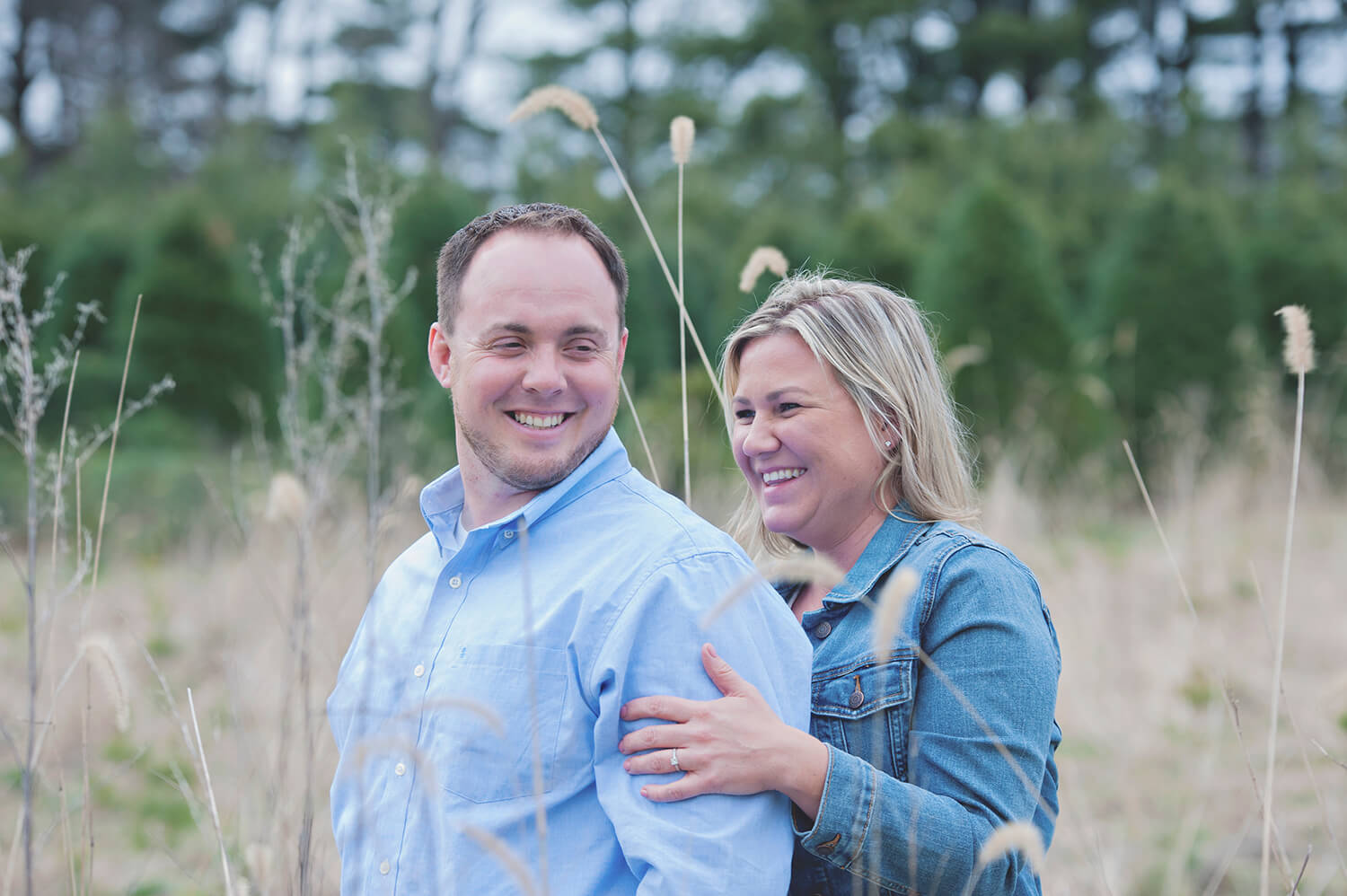 Engaged couple takes portraits at Williams Tree Farm in Rockton, IL