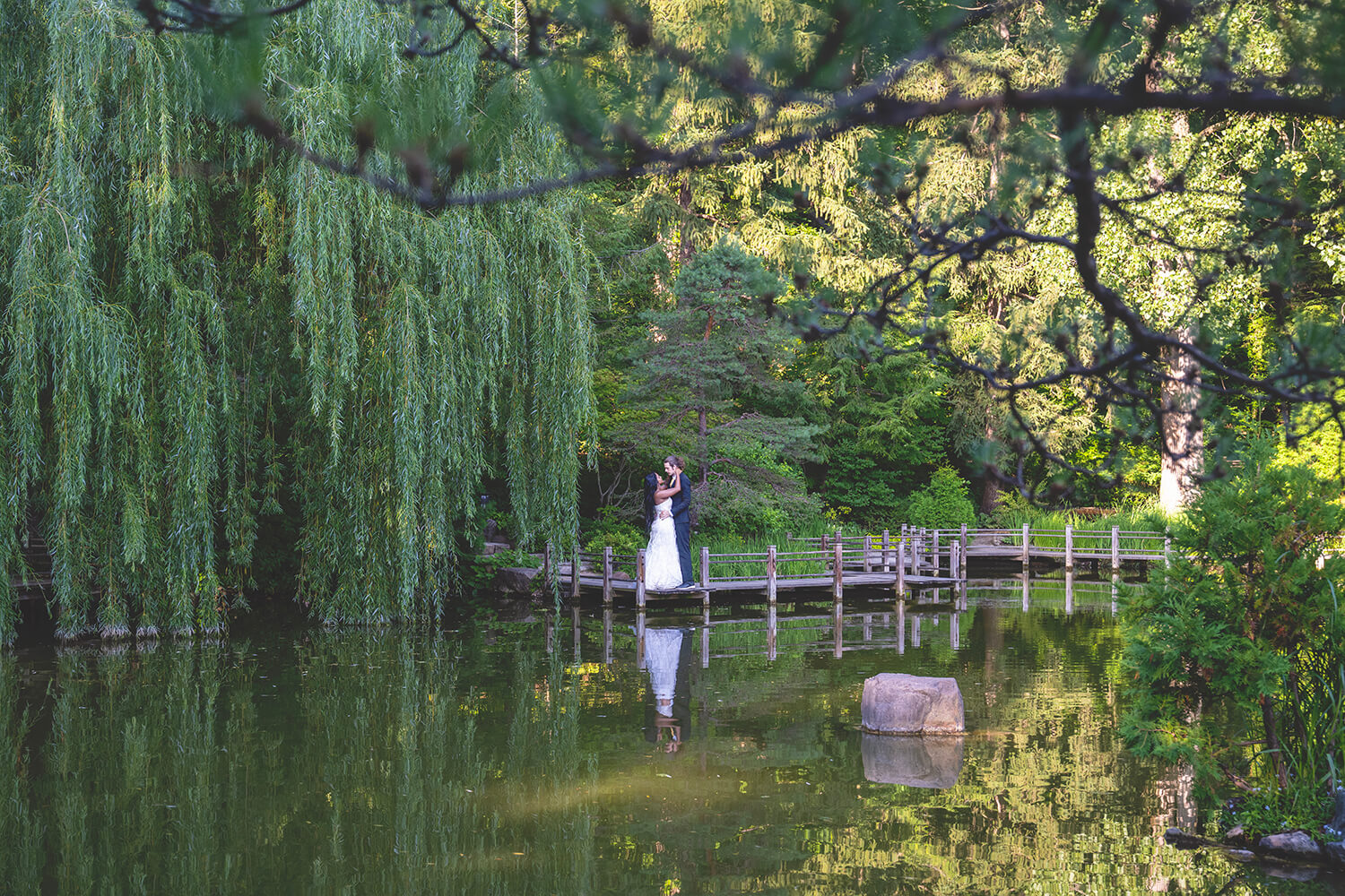 Mitch and Salina pose for wedding portraits at Anderson Japanese Gardens in Rockford, IL