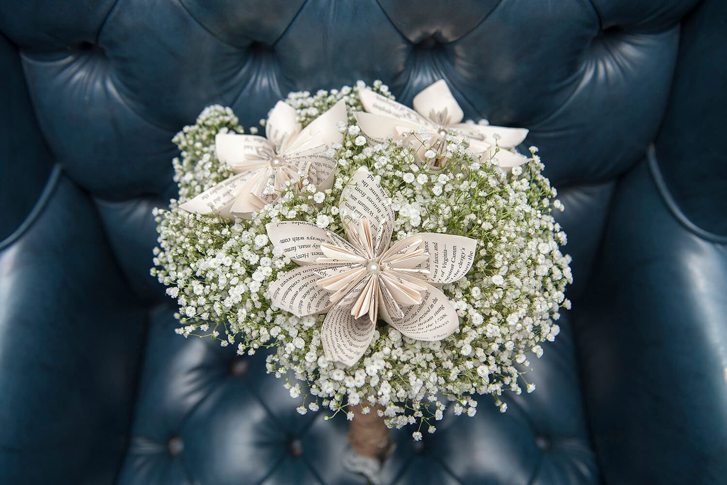 Bride bouquet made out of baby's breath and book pages