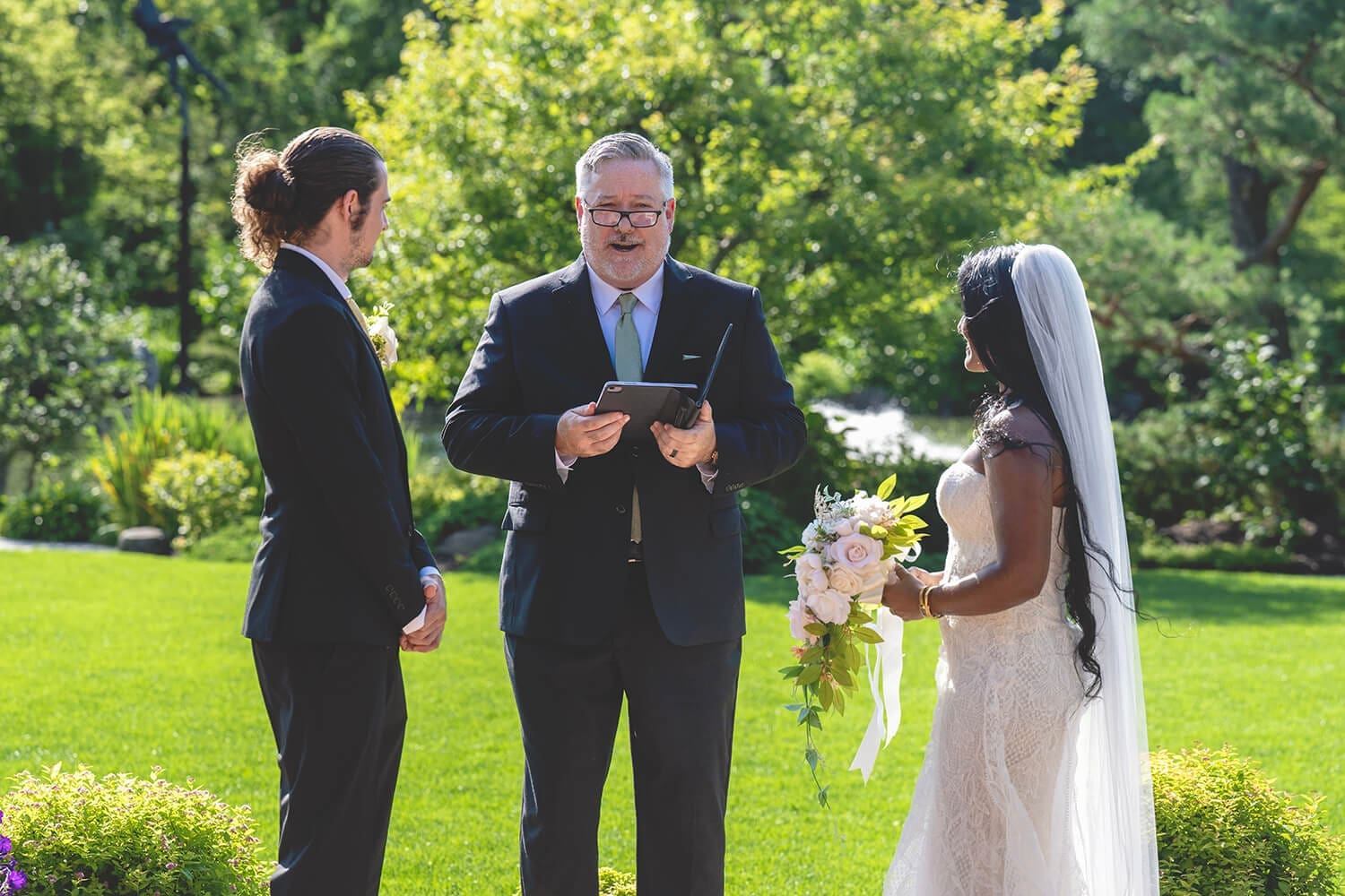 Mitch and Salina exchange vows at Anderson Japanese Gardens in Rockford, IL