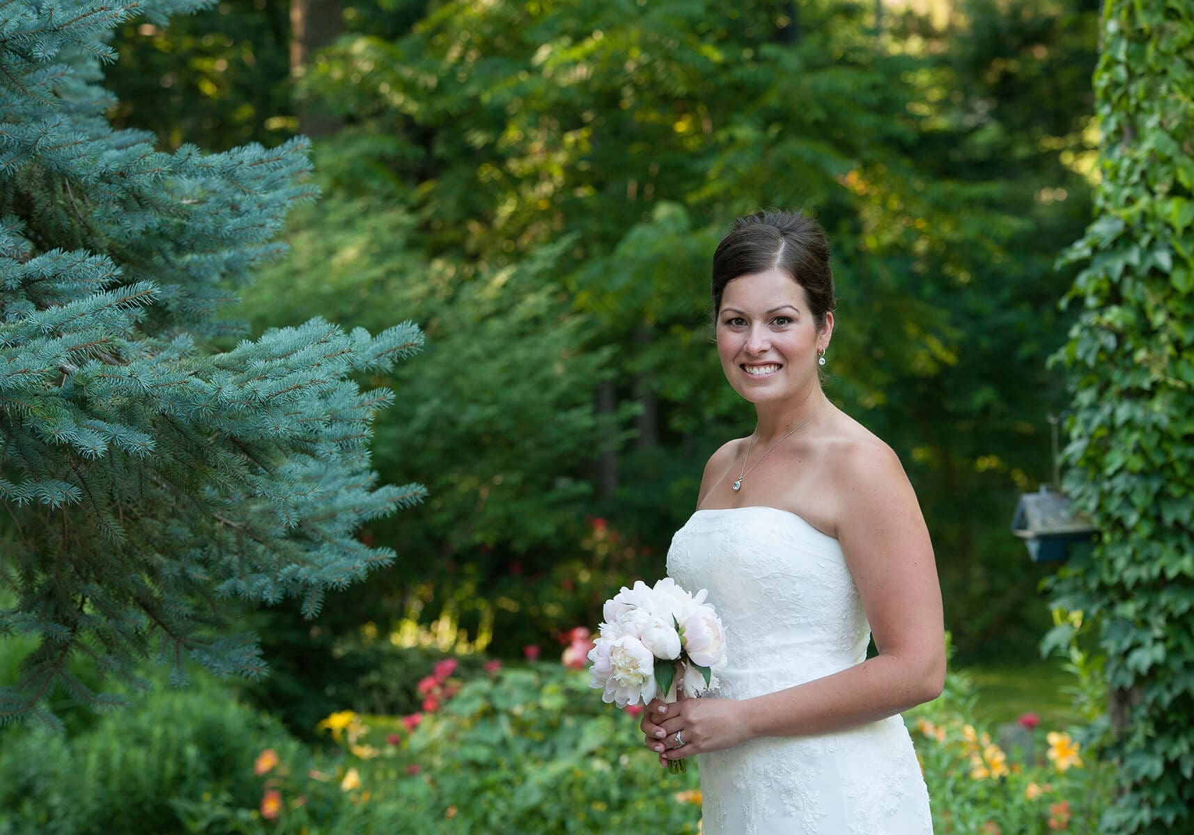 Portrait of just a bride in her home garden