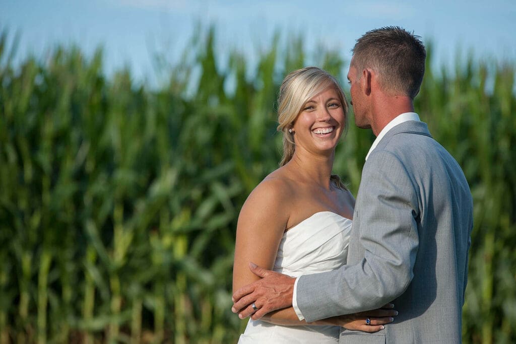 Wedding couple pose during portraits in a field in Northern Illinois
