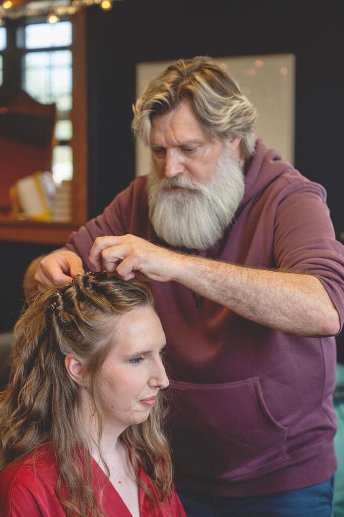 bride gets wedding hair done