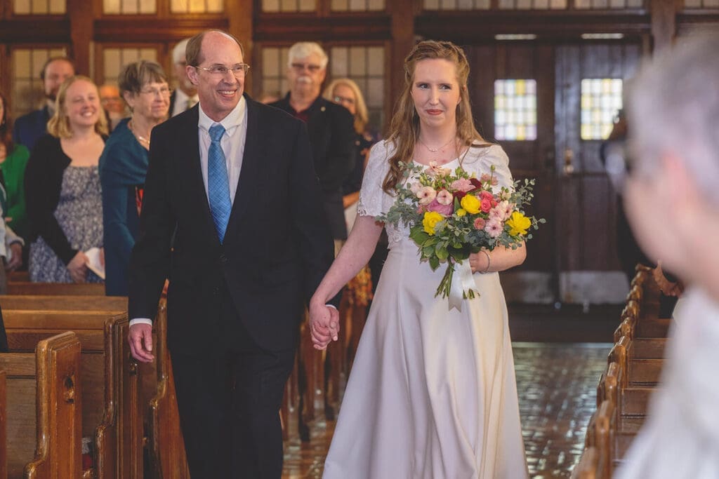 father walks bride down the aisle