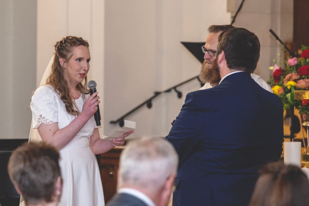 bride reads vows to groom