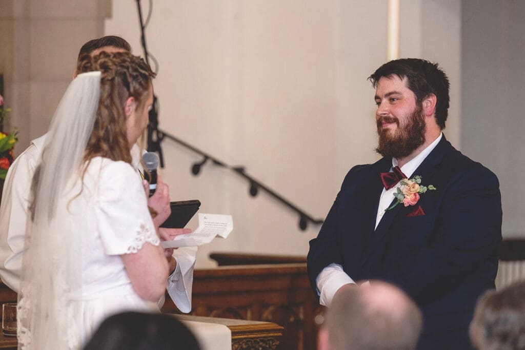 groom listens to brides vows