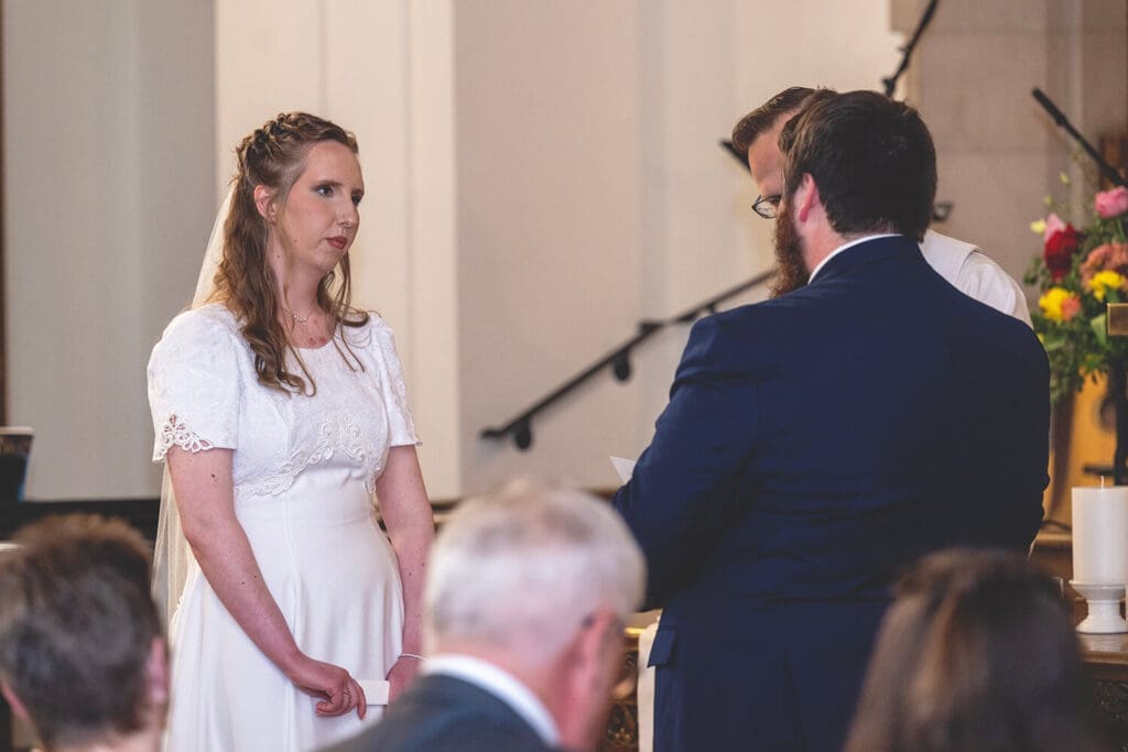 bride listens to grooms vows