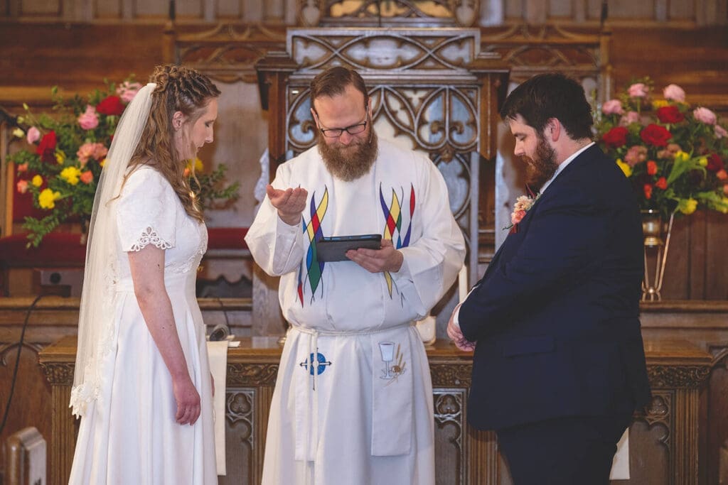 minister prays over rings