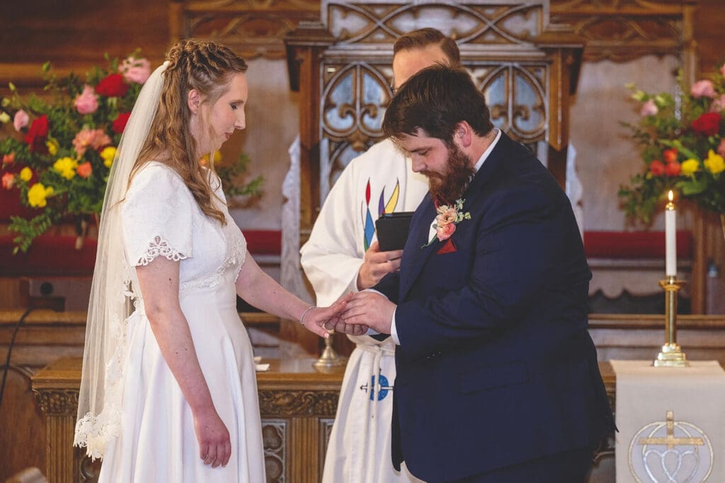 groom gives bride ring