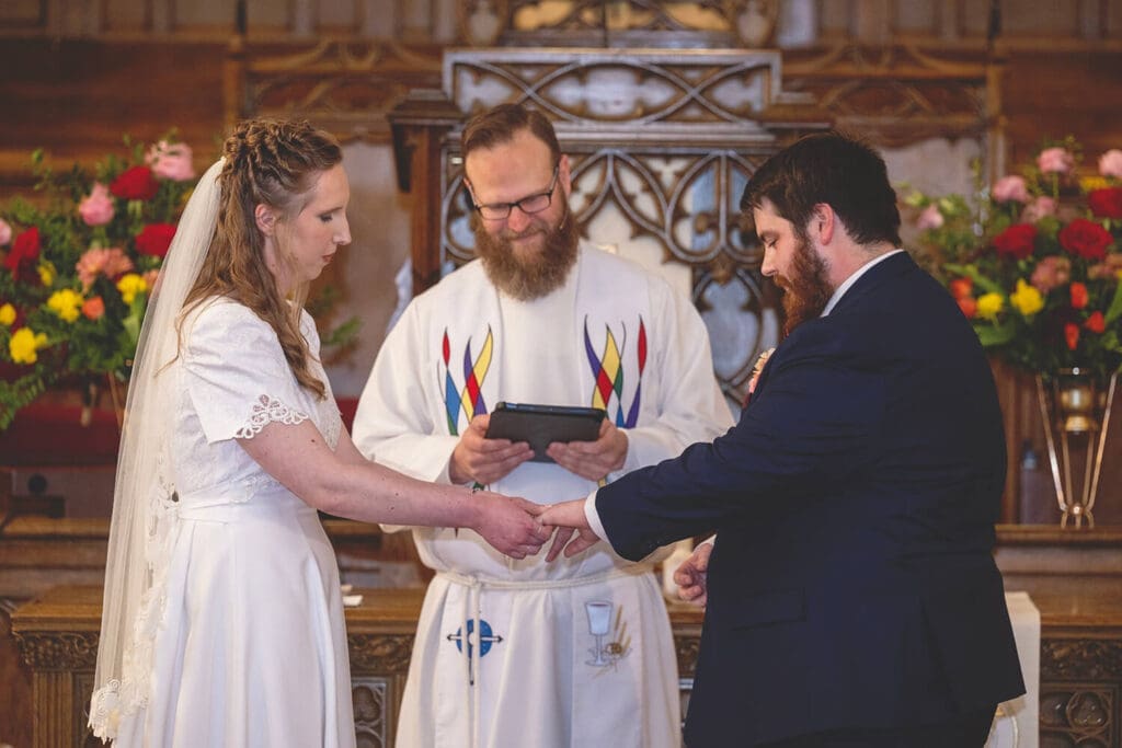 bride gives groom ring