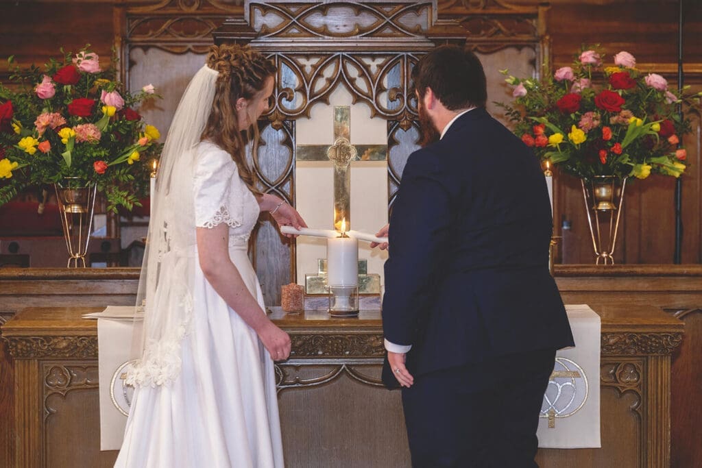 bride and groom light unity candle
