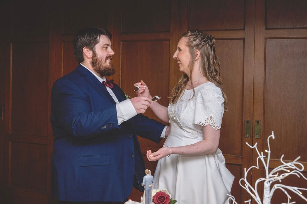 bride and groom to feed each other cake