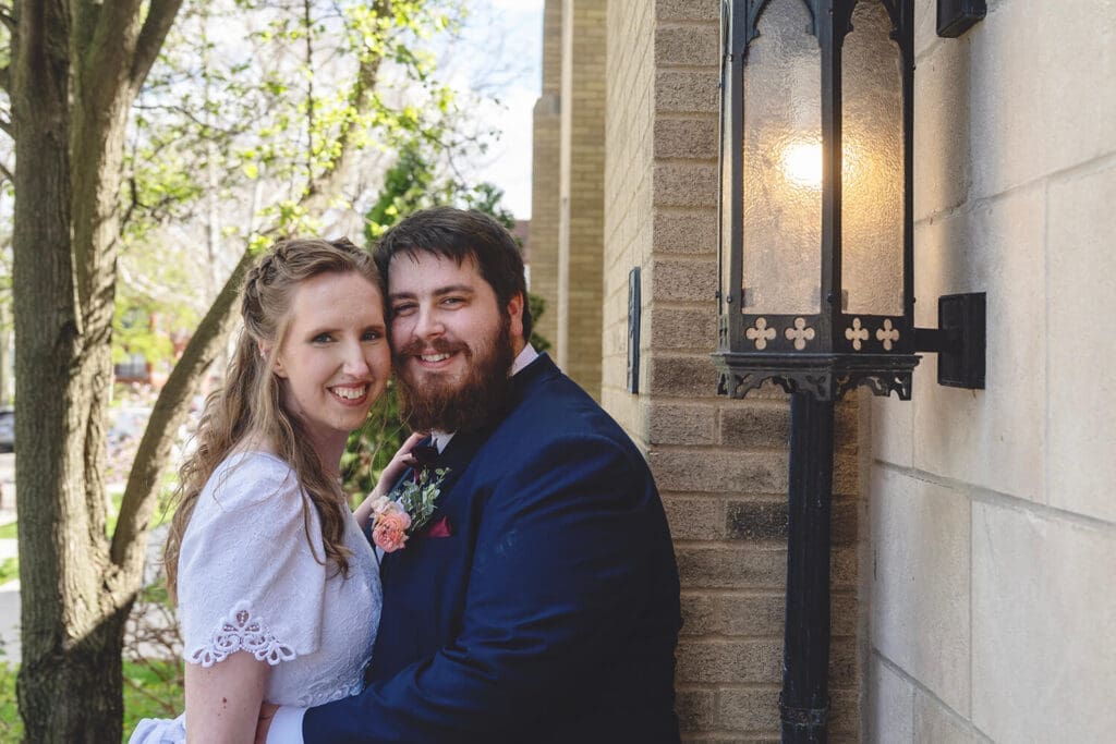bride and groom pose during wedding portraits