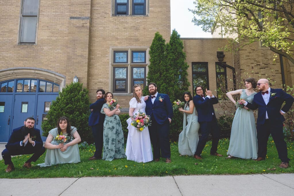 wedding party pose with bride and groom