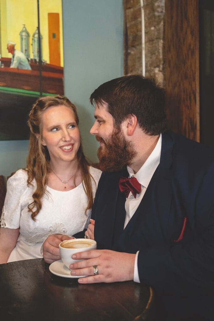 bride and groom enjoy coffee