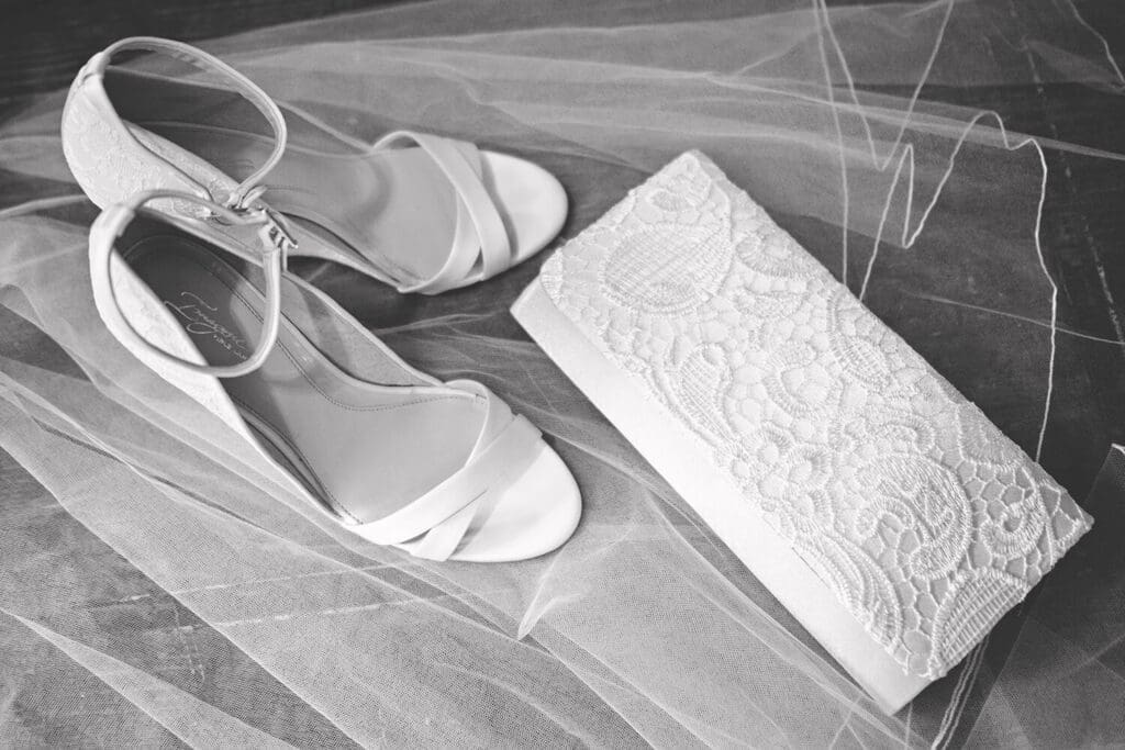 wedding shoes and purse on veil