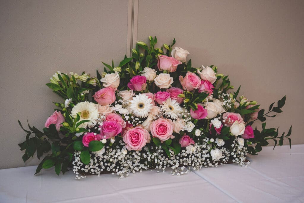 Real floral wedding centerpiece at wedding reception.