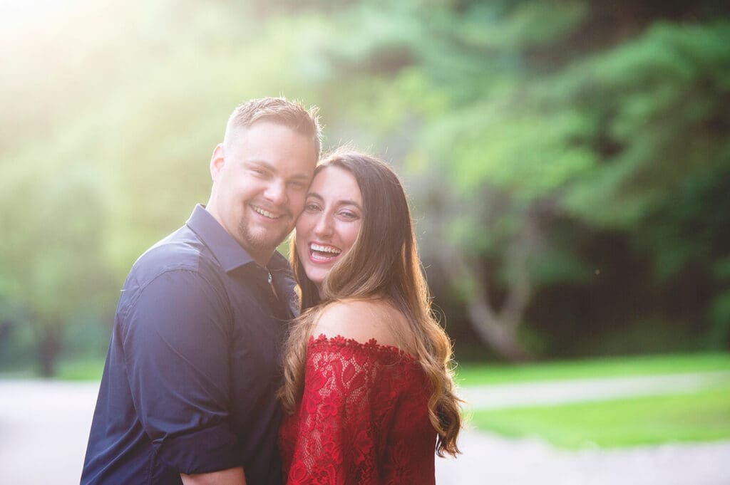 Engaged couple smile during portraits in Northern Illinois park