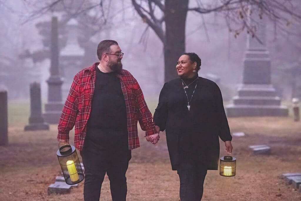 Engaged couple take portraits in cemetery in Rockford, IL