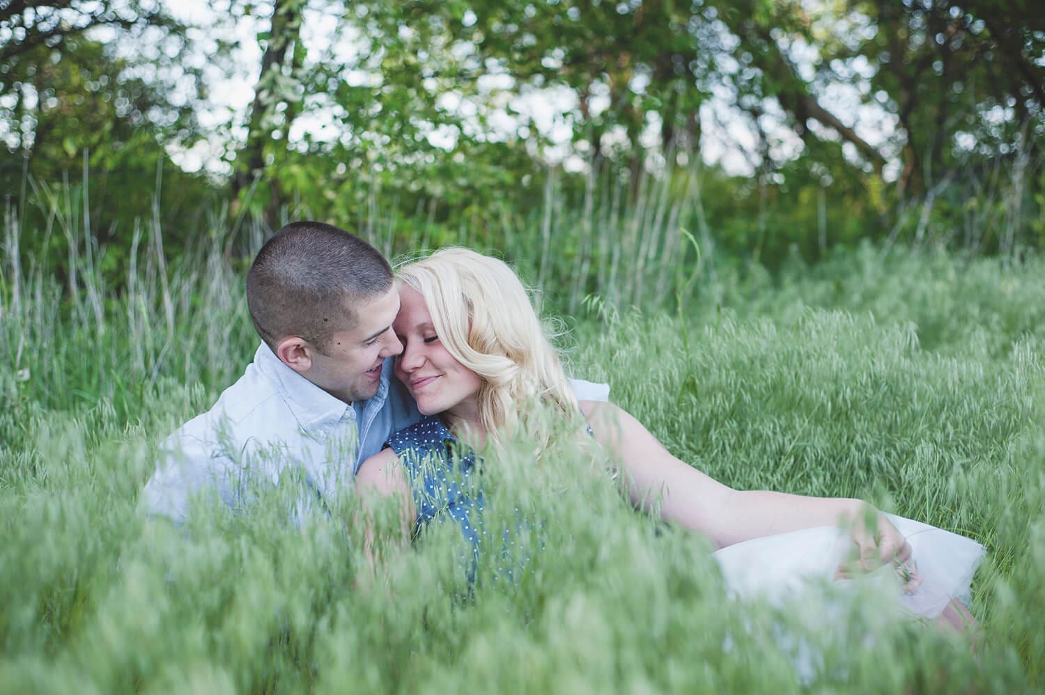 Jonny and Alyssa have engagement photos in tall grass fields in Northern Illinois